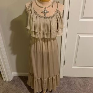 Sleeveless satin dress with ruffle top.